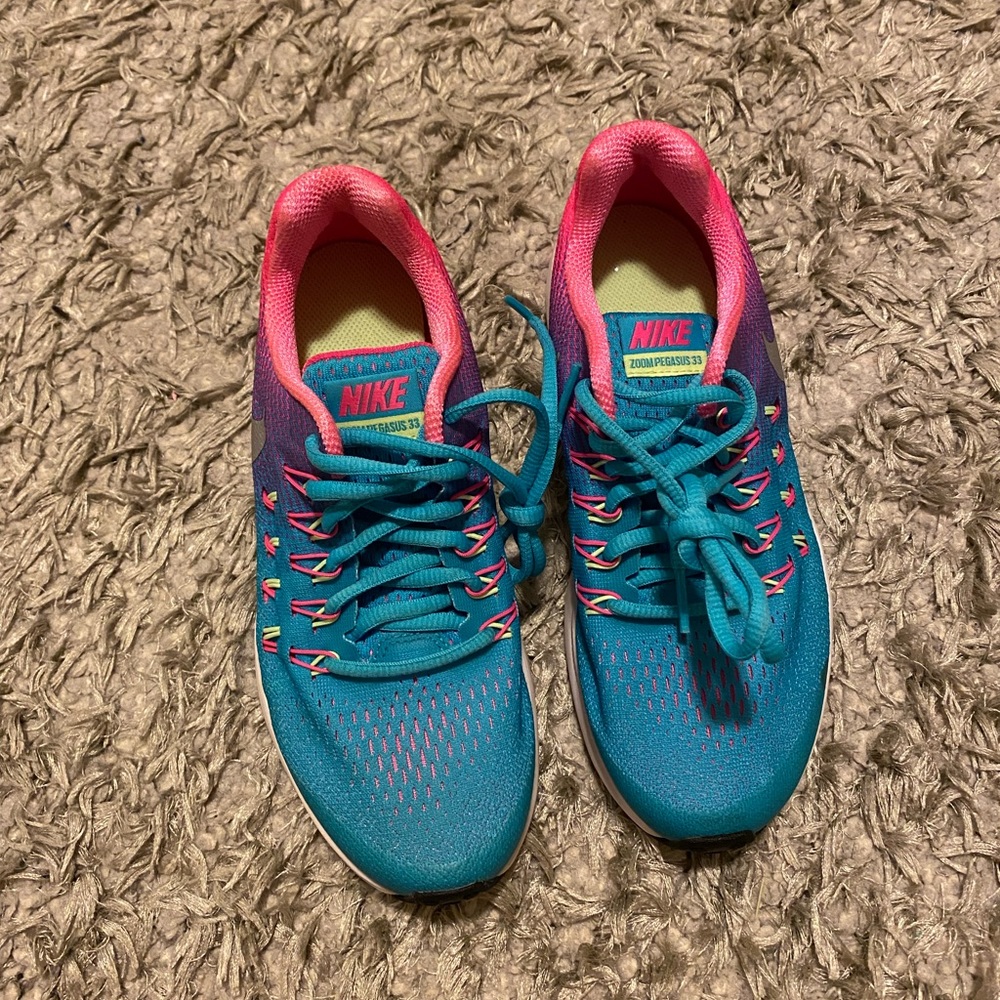 Kids nike shoes, colored blue purple and pink with neon green soles inside